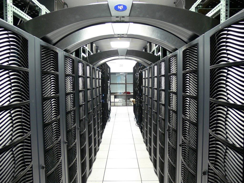 A large data center with visible cooling infrastructure and energy consumption meters