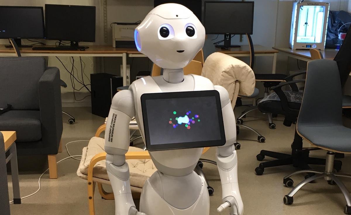 Pepper, the social robot, warmly interacting with a patient in a healthcare setting, providing information and emotional support