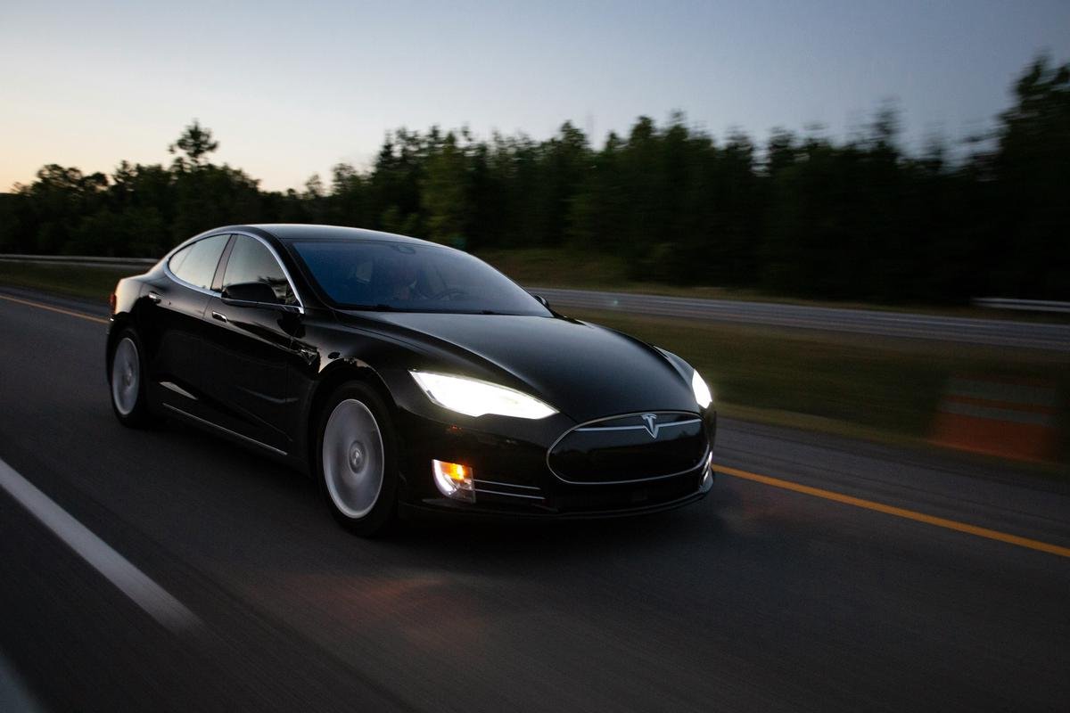 Conceptual image showing a Tesla car in the foreground with its Autopilot engaged, while traditional car brands fade into the background, symbolizing market disruption.